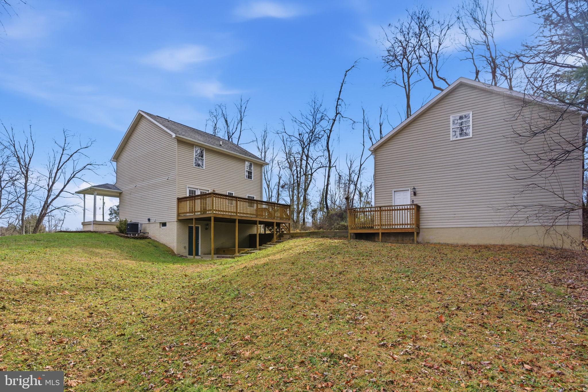 148 Vinca Lane Falling Waters, WV 25419 - Photo 53 of 71 a view of a house with a yard