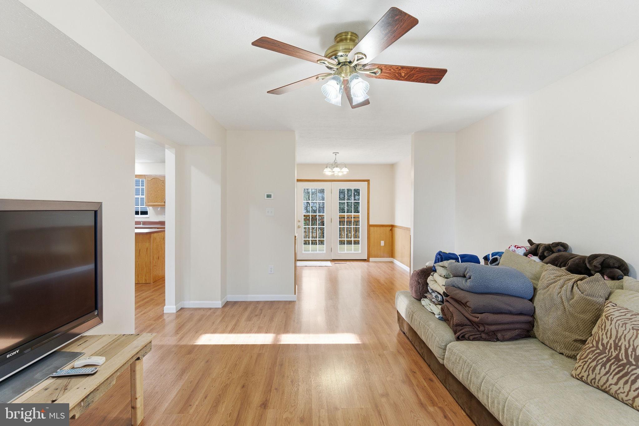 148 Vinca Lane Falling Waters, WV 25419 - Photo 9 of 71 a living room with furniture and a flat screen tv