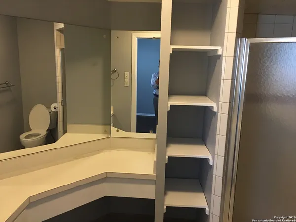 a bathroom with a sink and mirror
