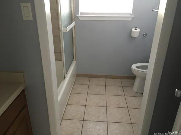 a bathroom with a sink and toilet