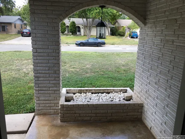 a view of swimming pool from a yard