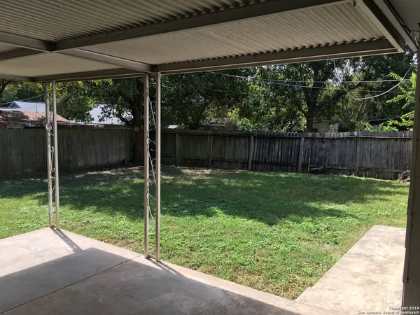 a view of backyard with green space