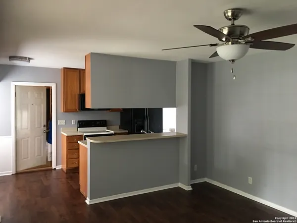a kitchen with a stove and a microwave