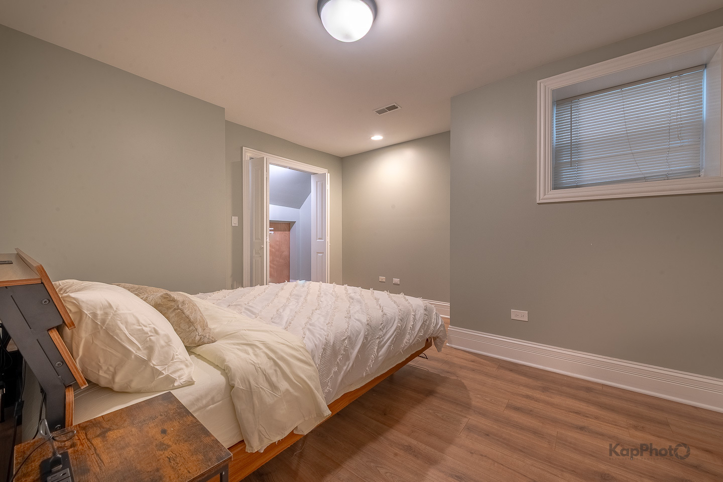 3639 North Troy Street, Unit 2 Chicago, IL 60618 - Photo 16 of 30 a bedroom with a bed and lamp