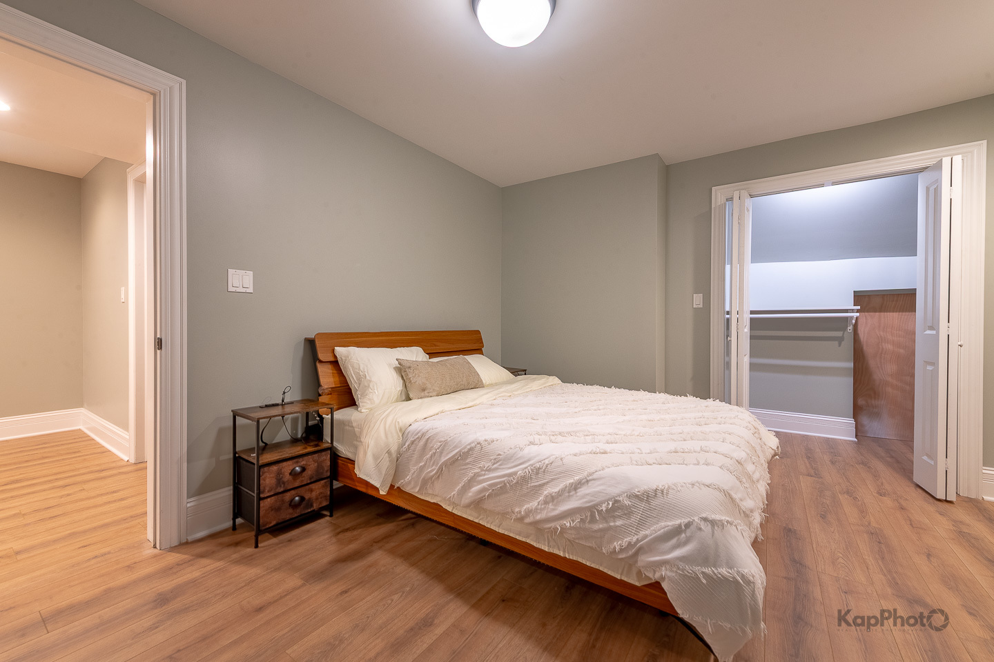 3639 North Troy Street, Unit 2 Chicago, IL 60618 - Photo 17 of 30 a bedroom with a bed and wooden floor