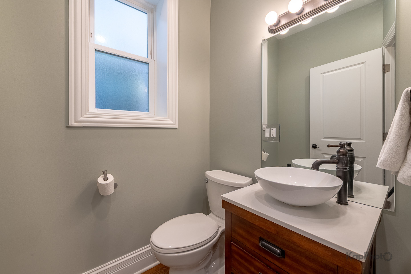 3639 North Troy Street, Unit 2 Chicago, IL 60618 - Photo 20 of 30 a bathroom with a sink a toilet and mirror