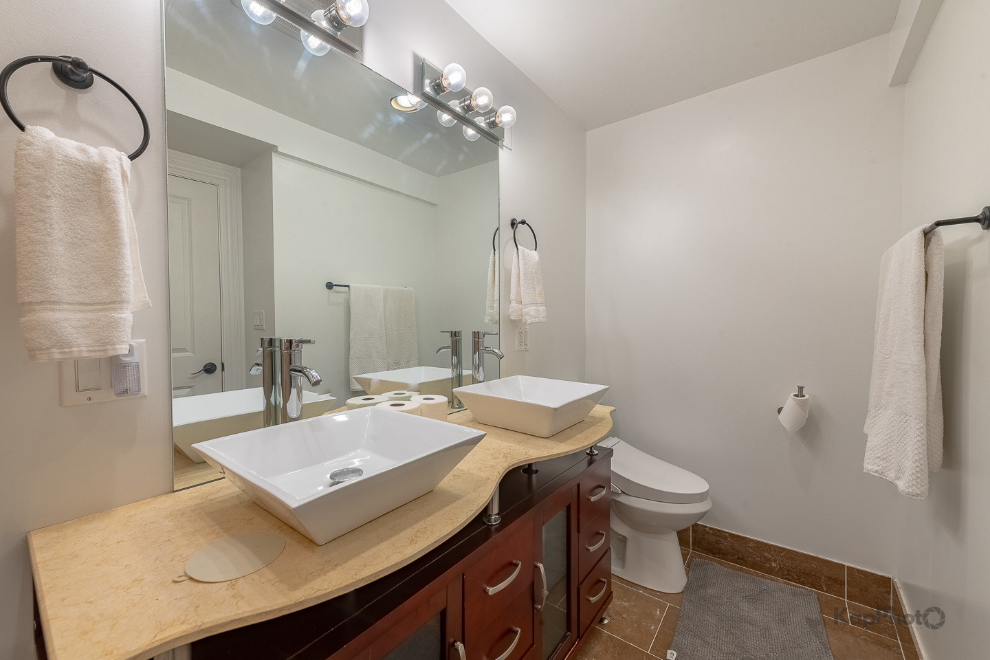 3639 North Troy Street, Unit 2 Chicago, IL 60618 - Photo 22 of 30 a bathroom with a sink a toilet and a mirror