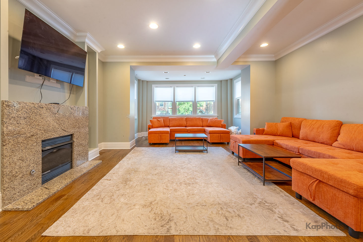 3639 North Troy Street, Unit 2 Chicago, IL 60618 - Photo 3 of 30 a living room with a couch and a fireplace