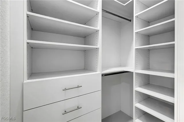 a view of an empty walk in closet
