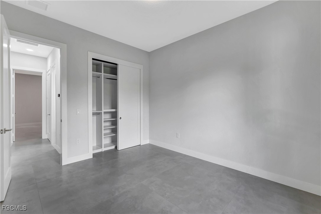 3366 72nd Avenue Northeast Naples, FL 34120 - Photo 18 of 49 an empty room with closet area