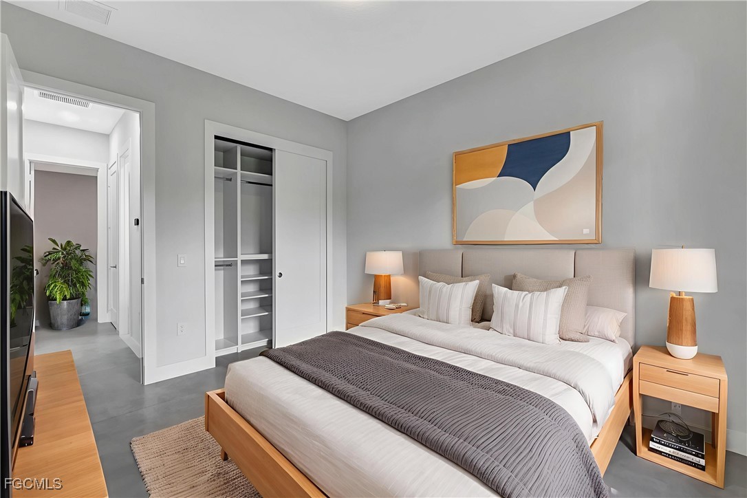 3366 72nd Avenue Northeast Naples, FL 34120 - Photo 19 of 49 a bedroom with bed and a couch