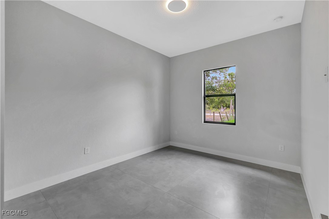 3366 72nd Avenue Northeast Naples, FL 34120 - Photo 21 of 49 an empty room with windows