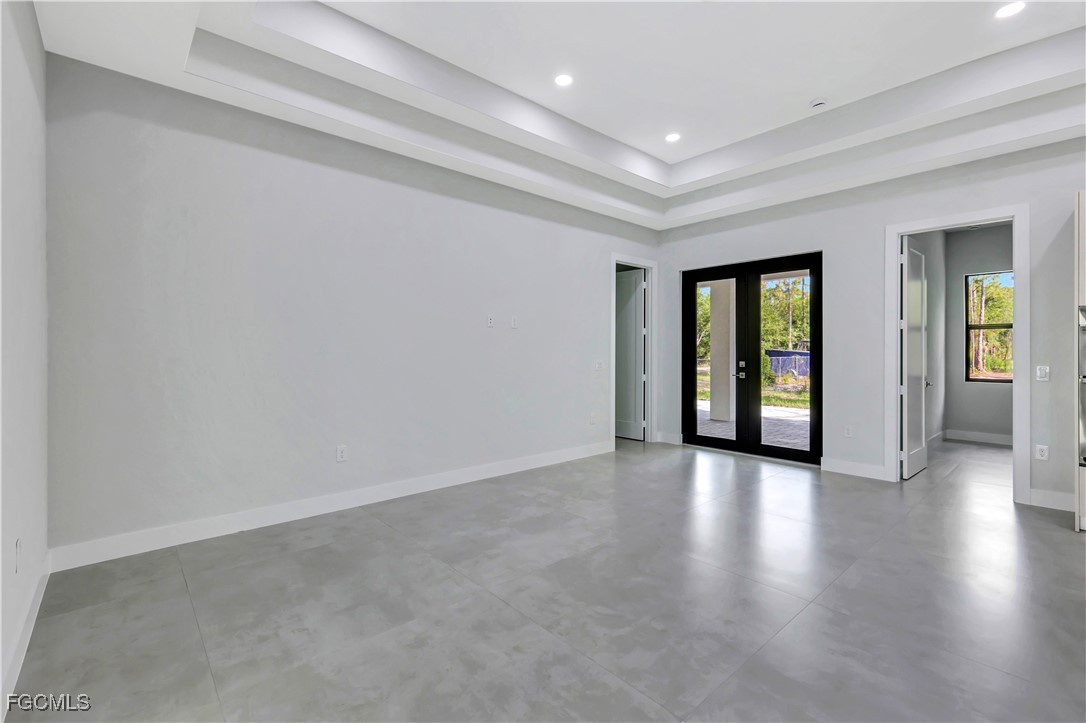 3366 72nd Avenue Northeast Naples, FL 34120 - Photo 25 of 49 a view of an empty room with window and wooden floor