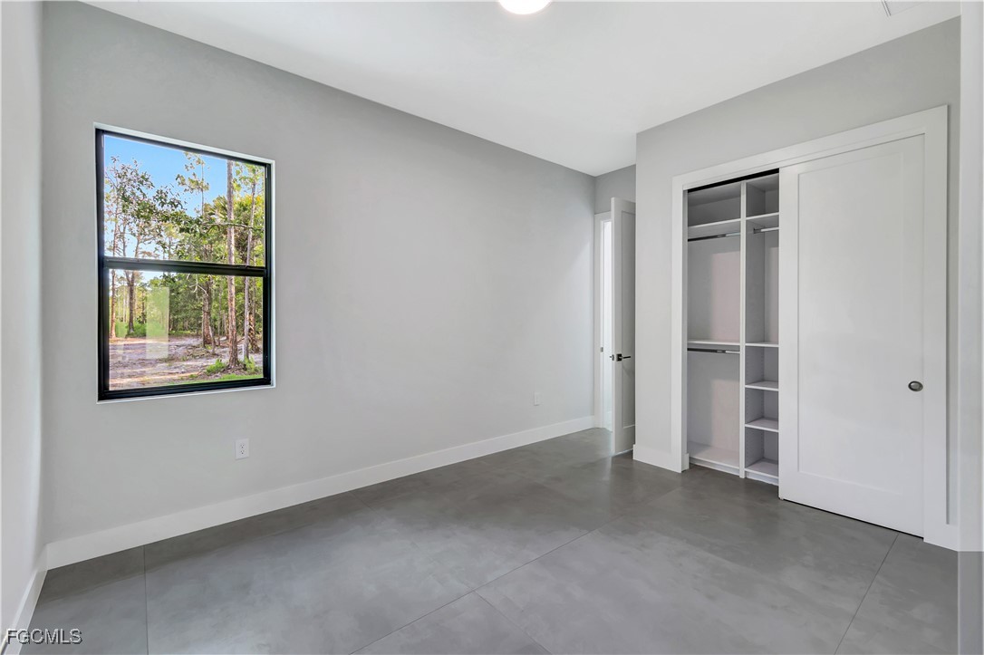 3366 72nd Avenue Northeast Naples, FL 34120 - Photo 27 of 49 an empty room with windows