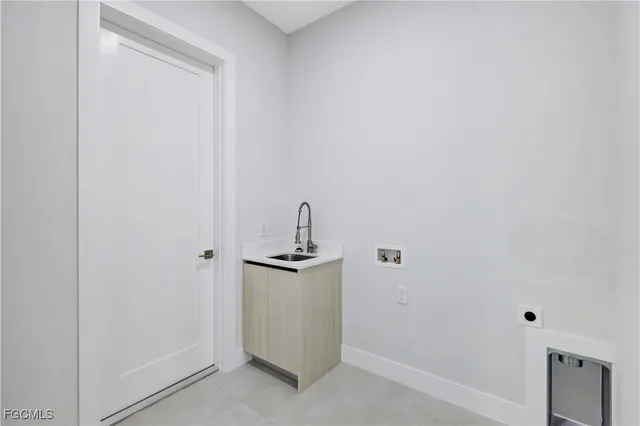 a view of an empty room with chandelier