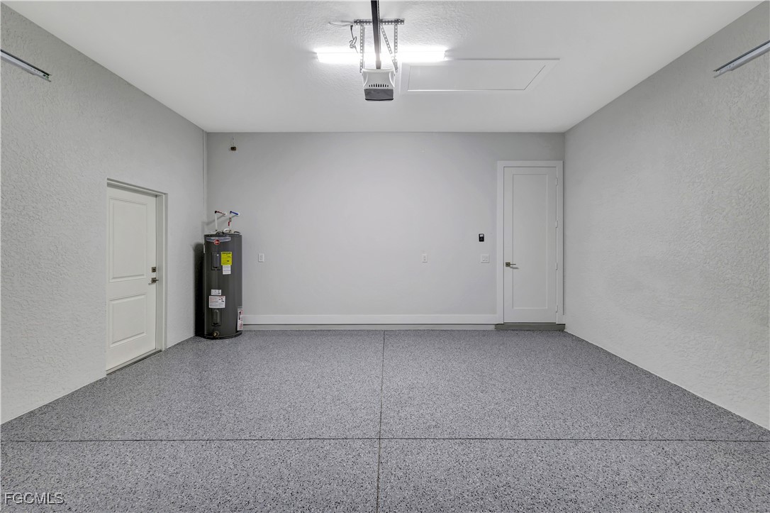 3366 72nd Avenue Northeast Naples, FL 34120 - Photo 30 of 49 a view of an empty room with chandelier