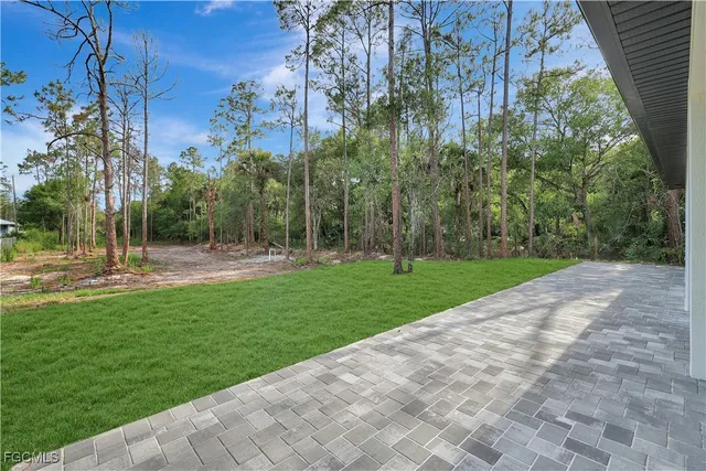 an aerial view of a house with big yard