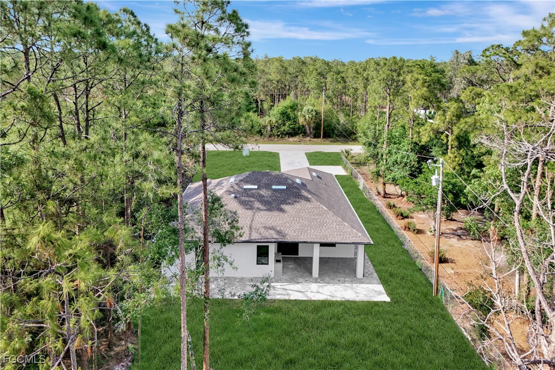 3366 72nd Avenue Northeast Naples, FL 34120 - Photo 39 of 49 front view of a house with a yard