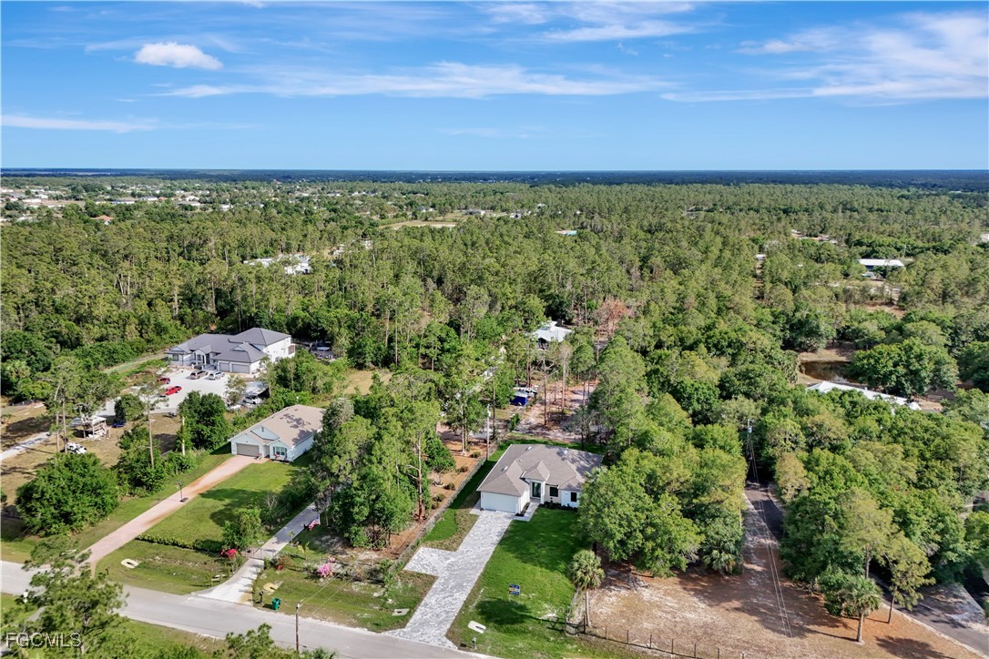 3366 72nd Avenue Northeast Naples, FL 34120 - Photo 41 of 49 an aerial view of residential houses with outdoor space and trees