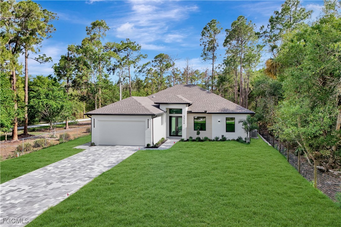3366 72nd Avenue Northeast Naples, FL 34120 - Photo 47 of 49 a aerial view of a house with yard and a garden