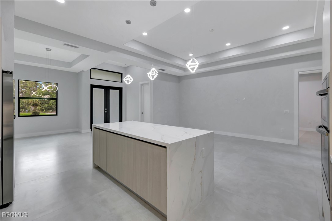 3366 72nd Avenue Northeast Naples, FL 34120 - Photo 8 of 49 wooden floor in an empty room with window and wooden floor