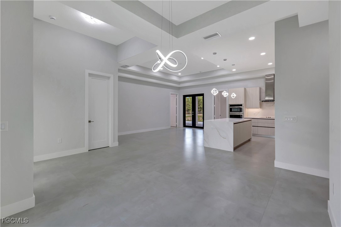 3366 72nd Avenue Northeast Naples, FL 34120 - Photo 10 of 49 a view of an empty room and a kitchen with a sink