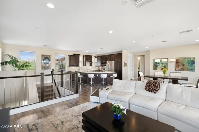 a living room with fireplace furniture and a floor to ceiling window