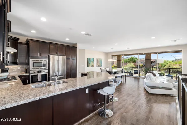 a kitchen with a table and chairs in it