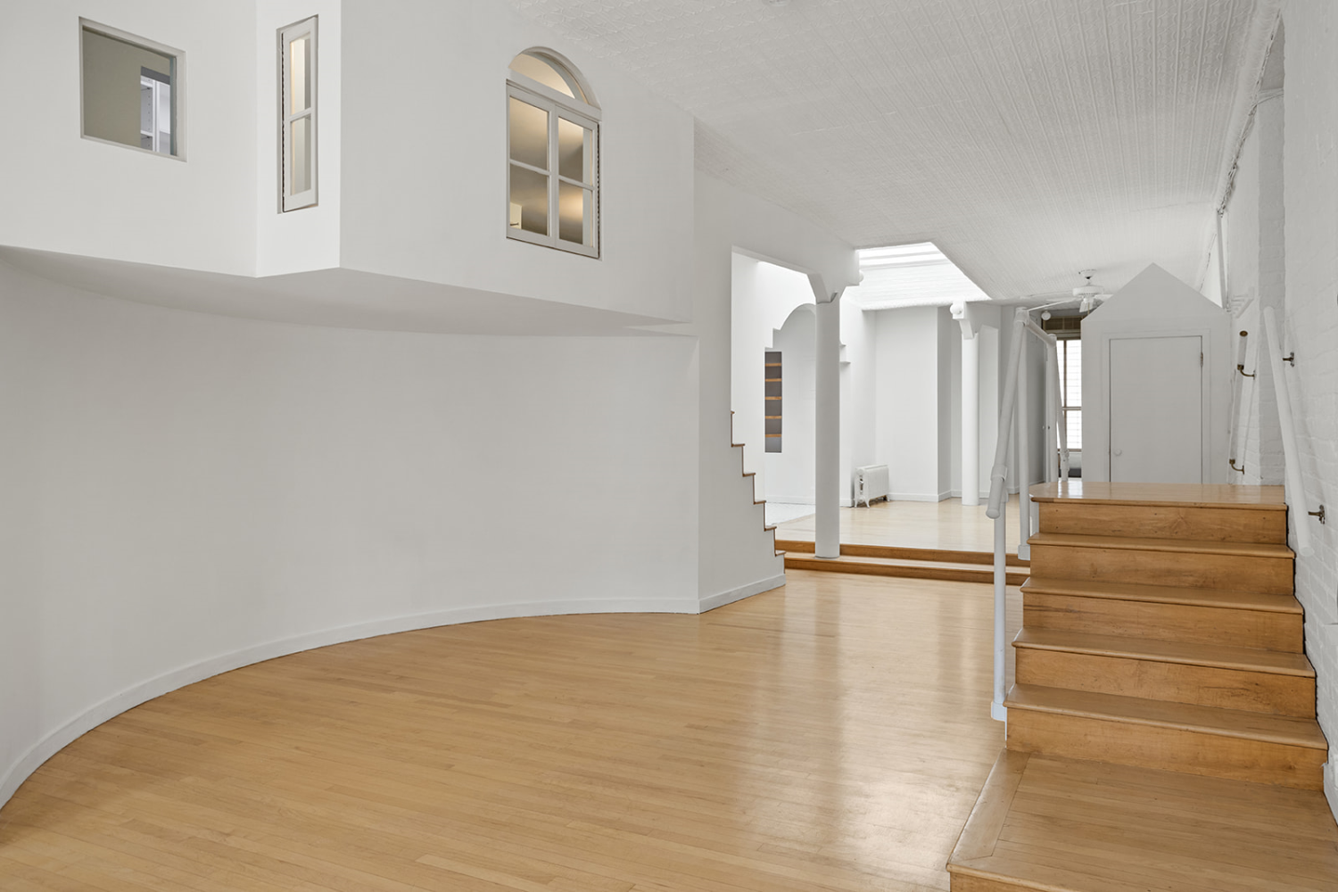 169 Spring Street, Unit 5W Manhattan, NY 10012 - Photo 15 of 20 a view of empty room with stairs