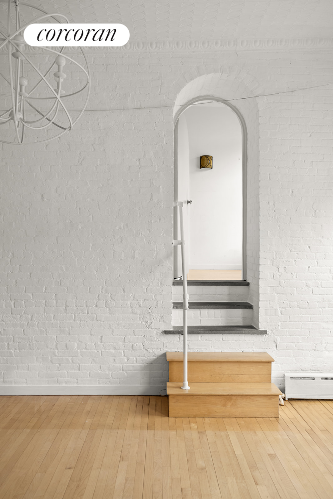 169 Spring Street, Unit 5W Manhattan, NY 10012 - Photo 4 of 20 a view of wooden floor