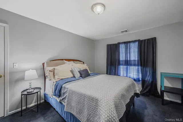 a bed room with a bed and a tv