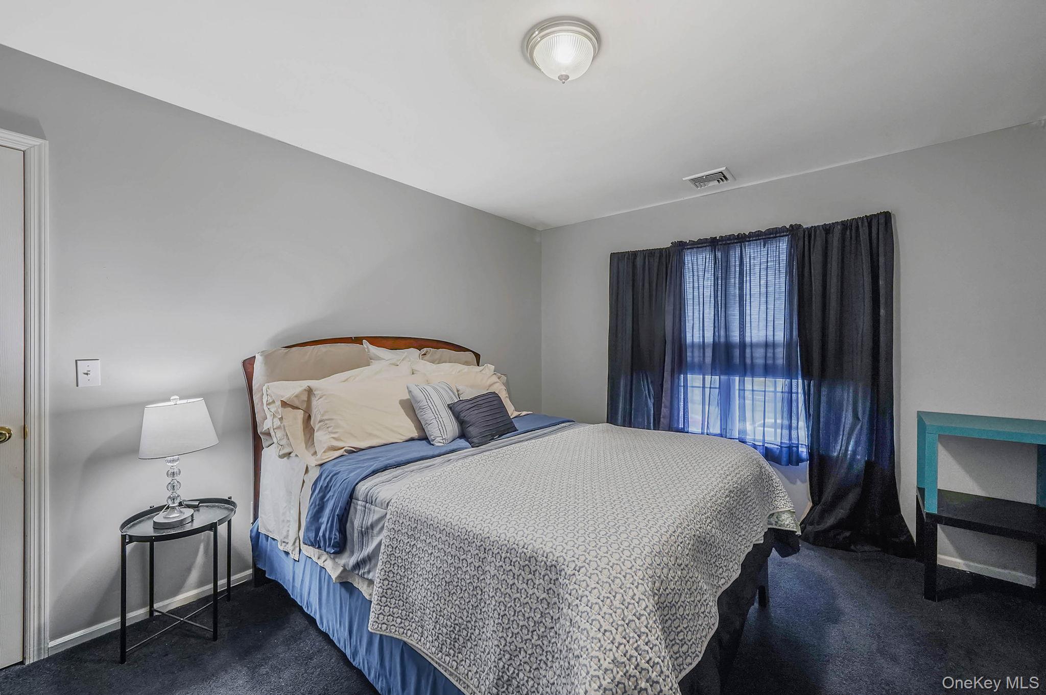 9 Paddock Lane Medford, NY 11763 - Photo 29 of 49 Carpeted bedroom featuring baseboards