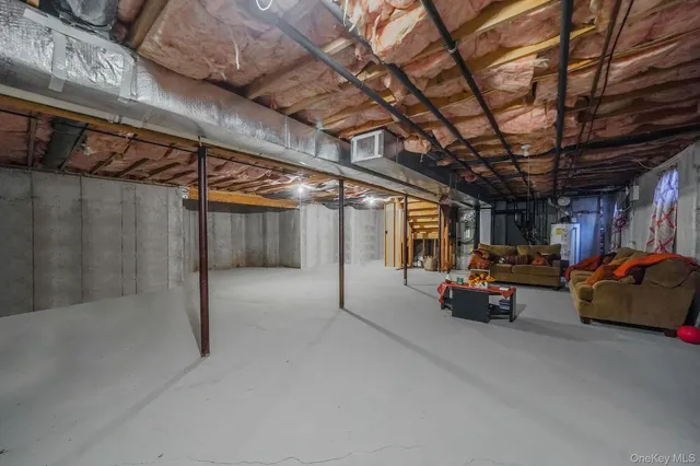 a living room with furniture and a ceiling fan