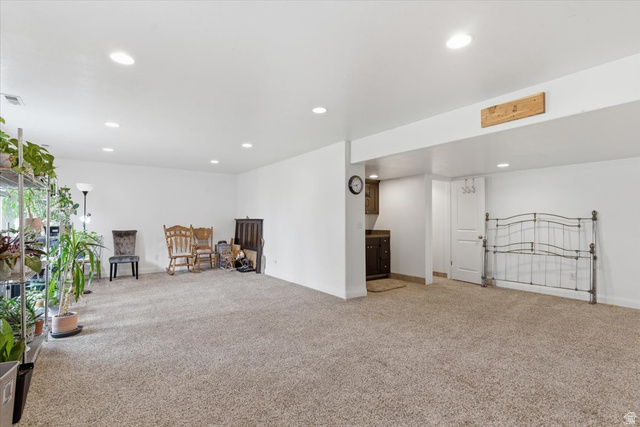 6237 West 4600th Street South Hooper, UT 84315 - Photo 33 of 48 Living area with light colored carpet and recessed lighting
