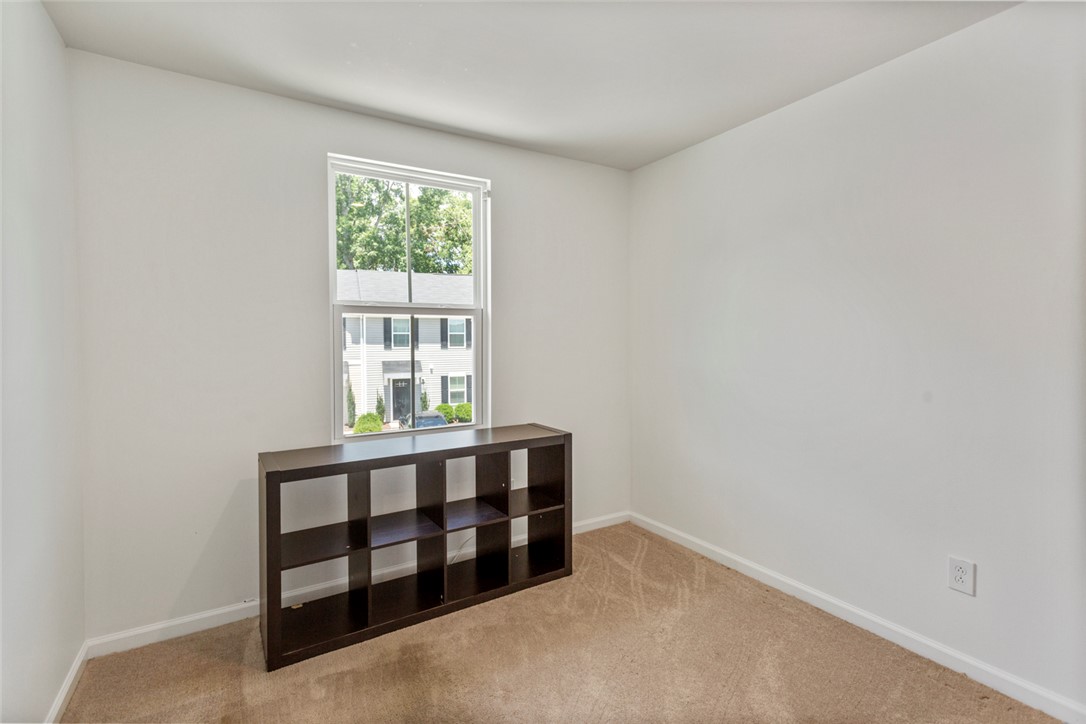 137 Nicklaus Drive Anderson, SC 29621 - Photo 26 of 37 A well-lit room offers a clear view of the peaceful neighborhood through its bright window.