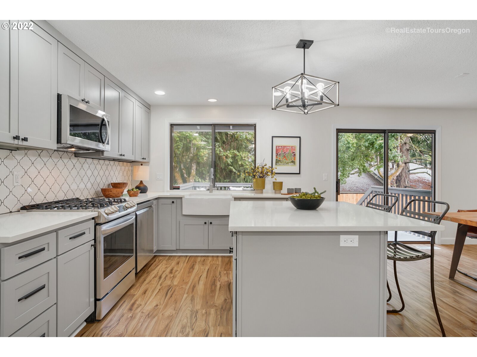 11280 Southwest Viewmount Court Tigard, OR 97223 - Photo 13 of 31 a kitchen with stainless steel appliances granite countertop a sink stove and refrigerator