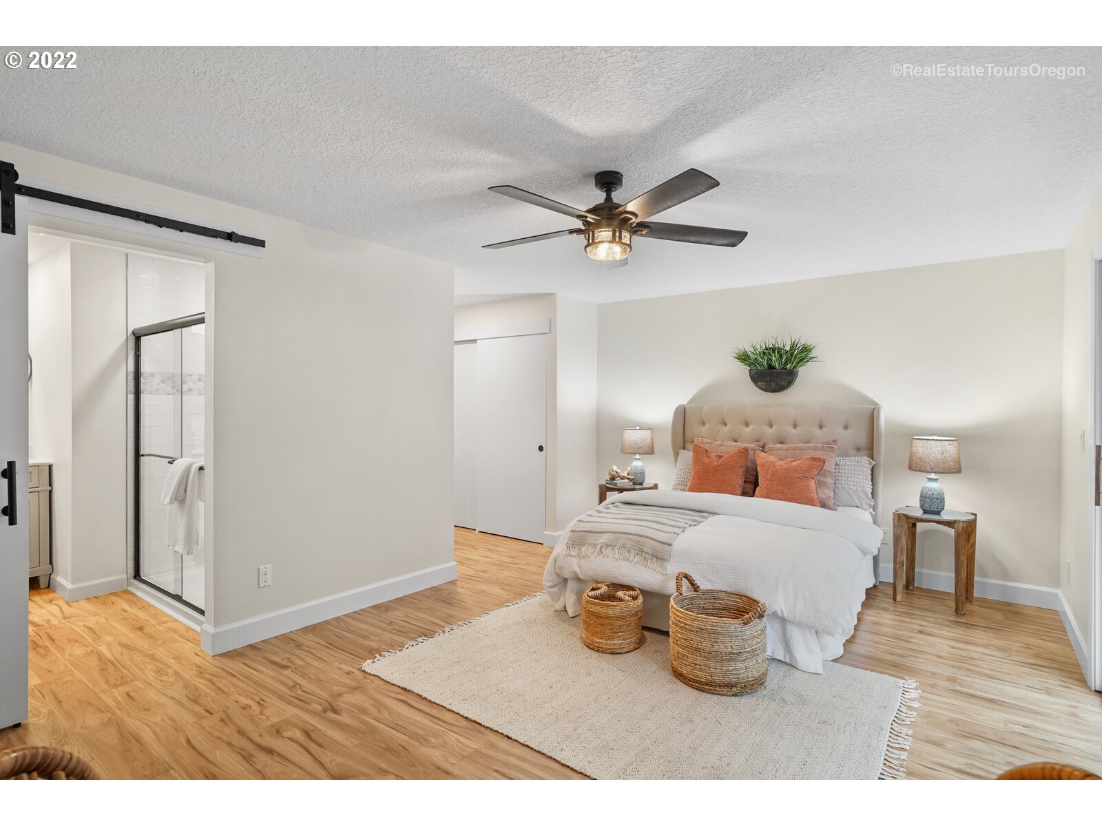 11280 Southwest Viewmount Court Tigard, OR 97223 - Photo 17 of 31 a bedroom with a bed and wooden floor