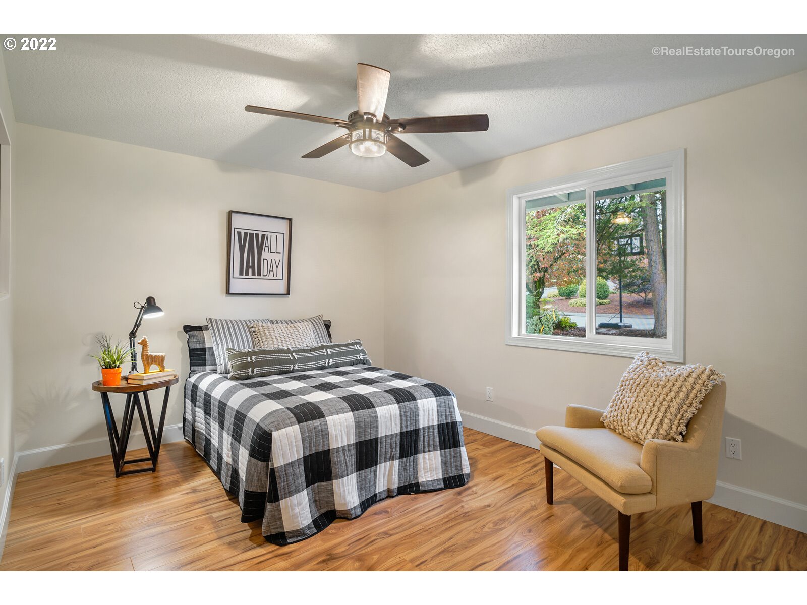 11280 Southwest Viewmount Court Tigard, OR 97223 - Photo 19 of 31 a bedroom with a bed and a window