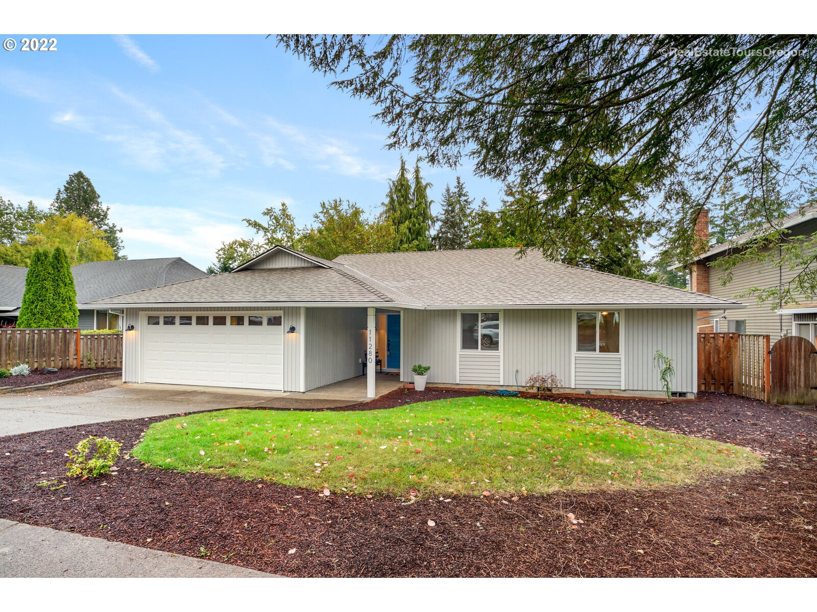 11280 Southwest Viewmount Court Tigard, OR 97223 - Photo 2 of 31 a view of a house with a yard and large tree