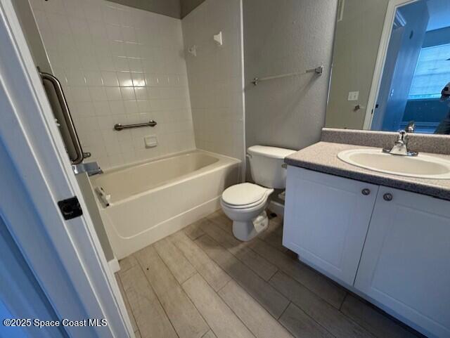 5692 Star Rush Drive, Unit 106 Melbourne, FL 32940 - Photo 13 of 16 a bathroom with a sink a toilet and shower