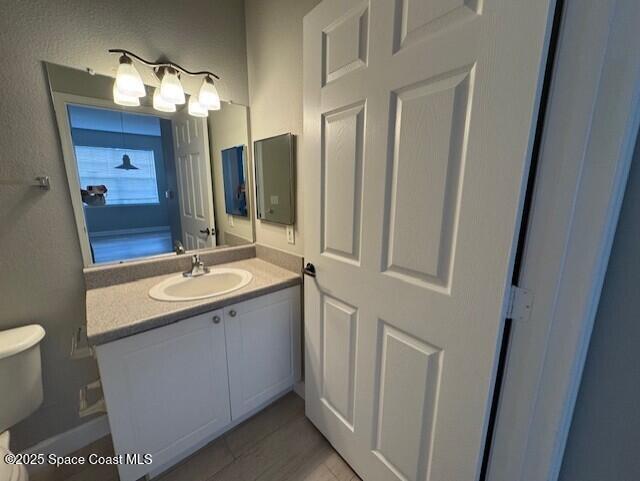 5692 Star Rush Drive, Unit 106 Melbourne, FL 32940 - Photo 14 of 16 a bathroom with a sink and a mirror