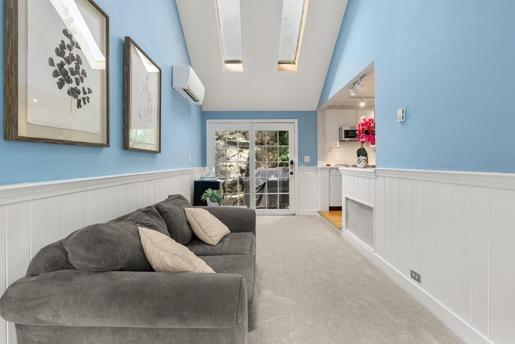 60 Valley Road Milton, MA 02186 - Photo 11 of 28 a living room with furniture and flowers