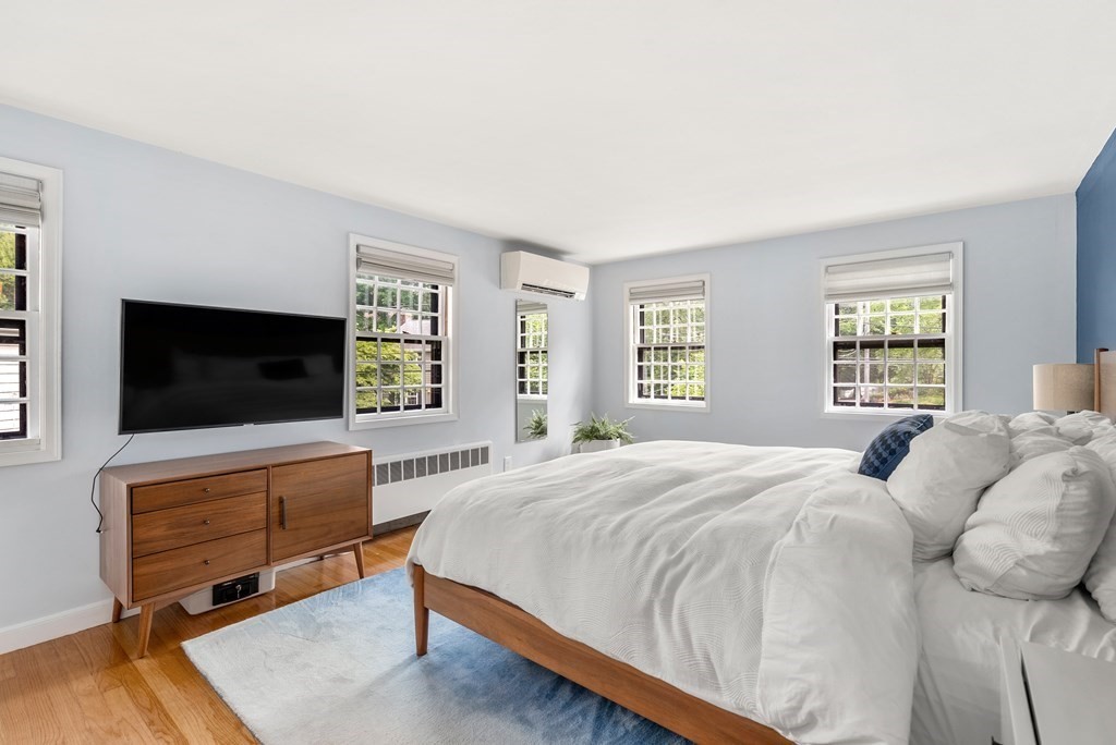 60 Valley Road Milton, MA 02186 - Photo 12 of 28 a bedroom with a bed and a flat screen tv