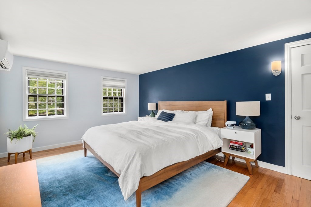 60 Valley Road Milton, MA 02186 - Photo 13 of 28 a bed sitting in a bedroom next to a window