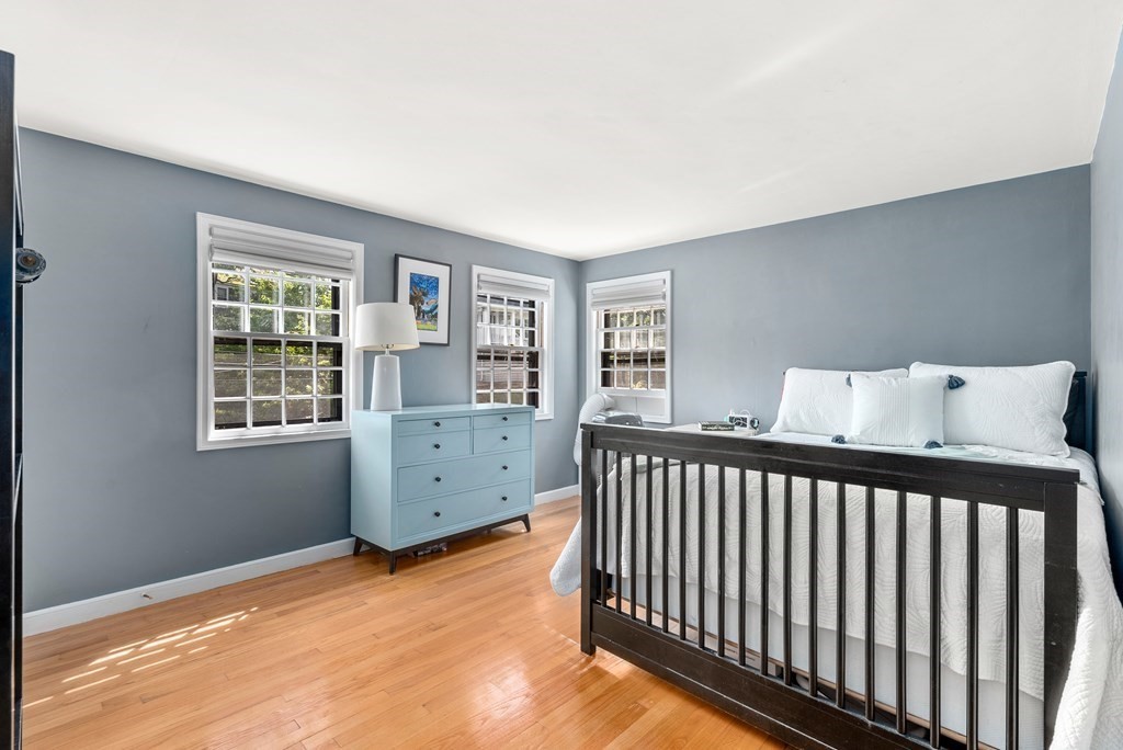 60 Valley Road Milton, MA 02186 - Photo 15 of 28 a view of a bedroom with furniture and windows