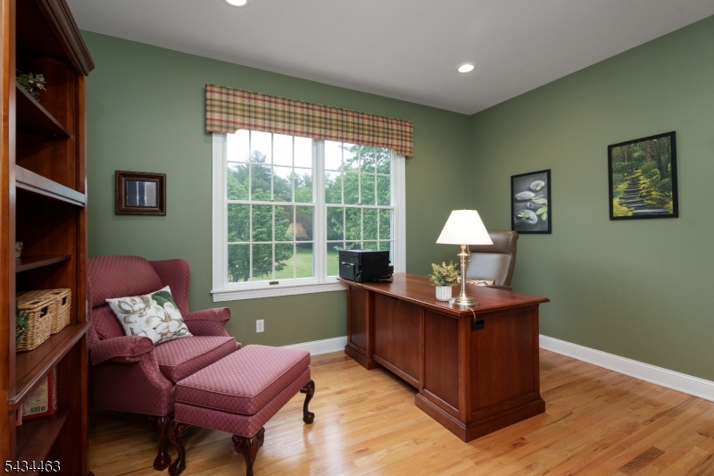 110 Orchard Road Skillman, NJ 08558 - Photo 19 of 43 a living room with furniture a large window and a flat screen tv