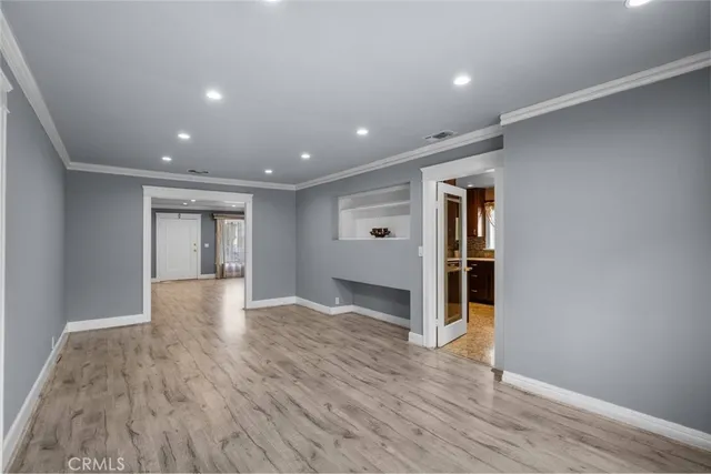 a kitchen with stainless steel appliances granite countertop sink stove and refrigerator