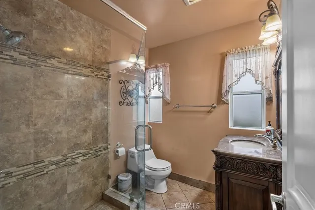 a bathroom with a toilet and a mirror