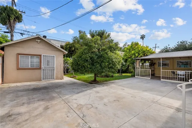 a view of a livingroom with furniture and a window