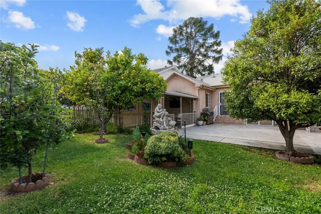a view of a house with a porch and furniture